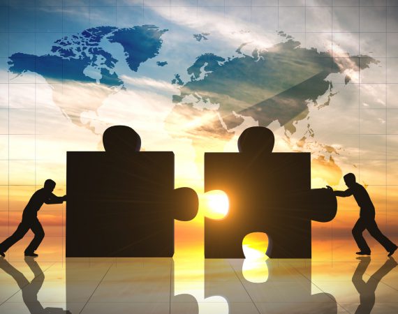 World Business teamwork puzzle pieces